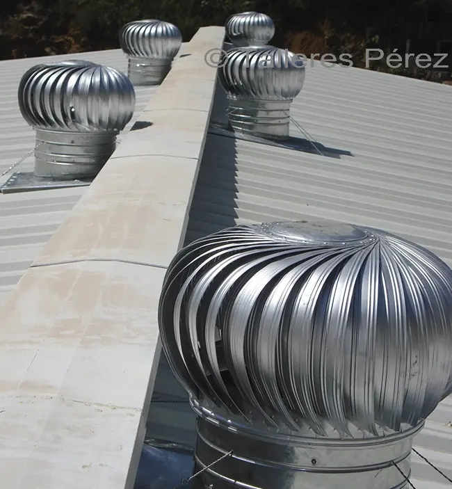 Ventilación Eólica en Edificios: Cómo Funciona y Cuándo es Efectiva - Dónde se usan los extractores eólicos edificio con ventilación eolica - Dónde se usan los extractores eólicos